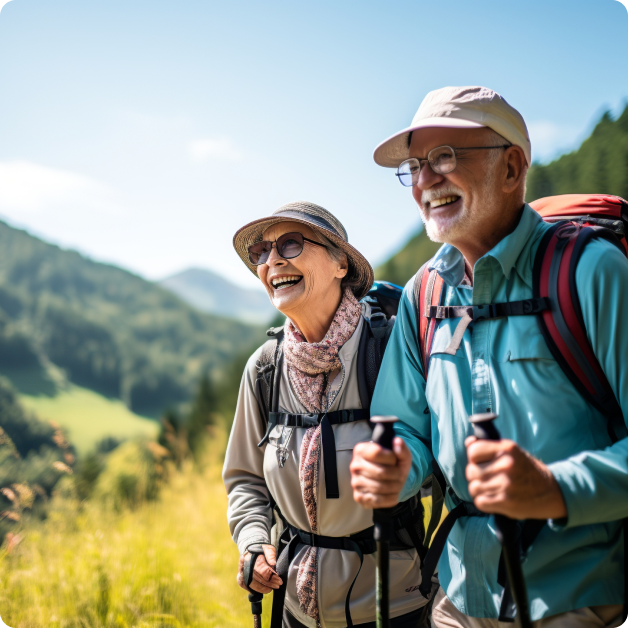 Elderly couple hiking in the mountains